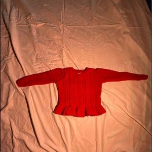 Toddler girl red sweater.